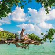 Digital Nomad Working From Her Tablet In A Tropical Location In Thailand, Southeast Asia